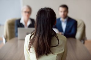 Two managers interviewing an illegal practitioner for a position